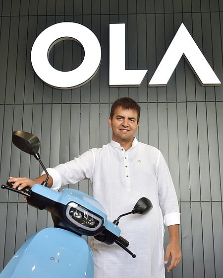 Bengaluru: Ola founder and CEO Bhavish Aggarwal poses with OLA E-Scooter at a launch press conference in Bengaluru. 