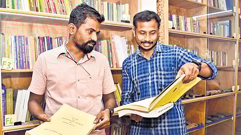 Sudhakar Nalliyappan and Kumaravel Ramasamy at the Yaakkai library in Coimbatore’s Chetti Street