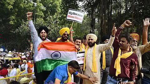 Members of Hindu Sikh Global Forum protest against the attack on a Hindu temple in Canada, near Canadian Embassy, in New Delhi on Sunday, Nov. 10.