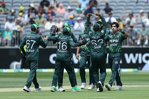 Pakistan players celebrate with Naseem Shah after he got the wicket of Australia’s Josh Inglis during the third one-day international (ODI) cricket match between Australia and Pakistan at the Perth Stadium in Perth on November 10, 2024.
