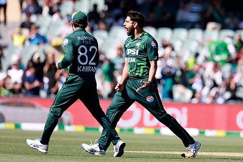 Pakistan's Hasan Ali, right, celebrates the wicket of Australia's Glenn Maxwell during their one day international cricket match in Adelaide, Australia, Friday.