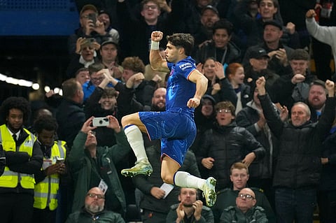 Chelsea's Pedro Neto celebrates after scoring his side's first goal during the English Premier League soccer match between Chelsea and Arsenal at Stamford Bridge stadium in London.