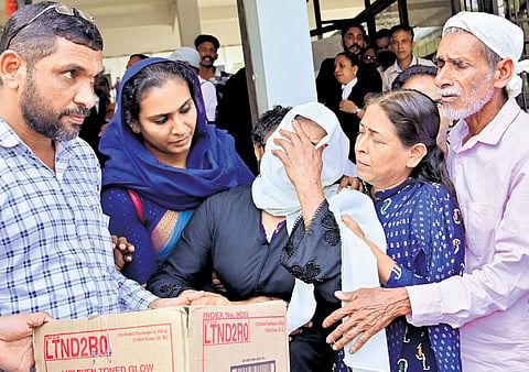 Safiya’s parents break down as they receive her mortal remains at the court building in Kasaragod on Monday 