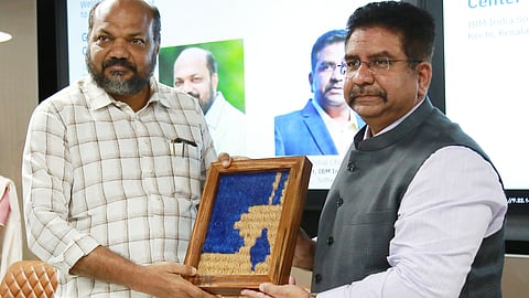 Vishal Chahal, vice president, IBM India Software Lab (right) hands over a memento made with coir by local artisans to Industries and Coir Minister P Rajeeve during the launch of IBM's GenAI Innovation Center at Lulu Cyber Tower-2, Infopark, Kakkanad.