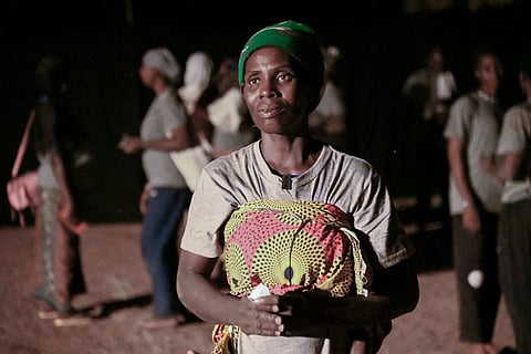 Fanta Charlotte Denbe, a mother of three who fled her village after it was attacked by extremists, participates in Recreatrales, an international theater festival held in Ouagadougou, Burkina Faso, Monday, Oct. 28, 2024