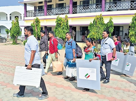 Poll officials leave the mustering centre at JMJ High School in Shiggaon on Tuesday | X