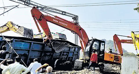 Officials oversee restoration of the railway track after the accident on Wednesday