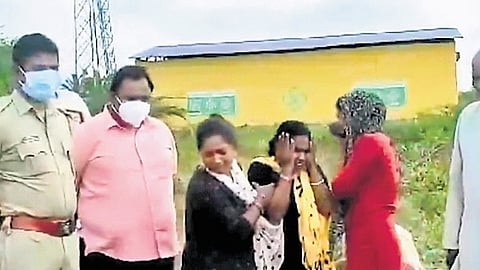 The relatives of the boy, Yellapa, during the exhumation of his body at Yamnnur village on Thursday