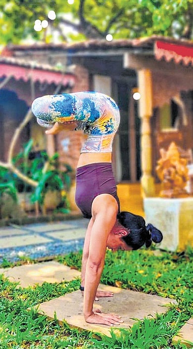 A guest practises yoga in the courtyard at Turiya Villa in South Goa.