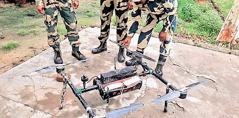 Security personnel with Pakistan drone captured in Srinagar.