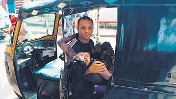 The injured woman being taken to hospital in an auto-rickshaw 