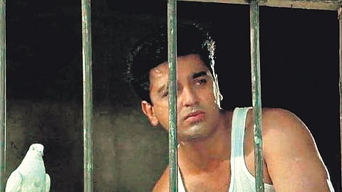An image of actor Kamal Haasan from the movie Nayagan, which tells the story of a vigilante gangster in the slums of Dharavi.