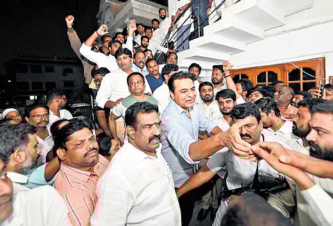 BRS working president KT Rama Rao greets party workers at former chief minister K Chandrasekhar Rao’s residence in Nandinagar, Hyderabad on Friday