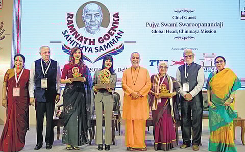 Ramnath Goenka Sahithya Samman awardees Ruskin Bond (represented by granddaughter Srishti), who was conferred the Lifetime Achievement Award (4th from L), Non-fiction award winner Neerja Chowdhury (6th from L) and Fiction award winner Aishwarya Jha (3rd from L) with (from L) TNIE CEO Lakshmi Menon, TNIE CMD Manoj Kumar Sonthalia, Chinmaya Mission global head Swami Swaroopanandaji, TNIE Editorial Director Prabhu Chawla, and TNIE Editor Santwana Bhattacharya, in New Delhi on Friday.