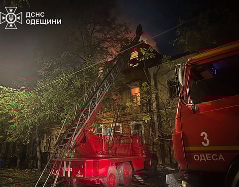 In this photo provided by the Ukrainian Emergency Service, emergency services personnel work to extinguish a fire following a Russian attack in Odesa, Ukraine, late Thursday, Nov. 14, 2024.