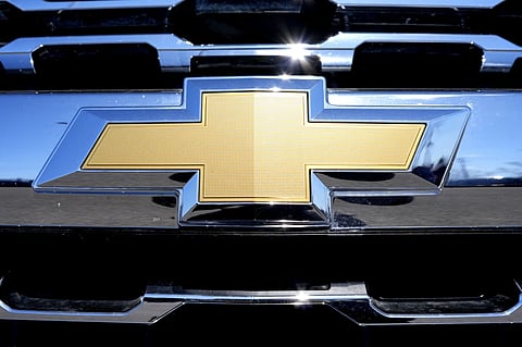 The Chevrolet logo is seen at a new and used vehicles dealership in Palatine, Ill., on March 20, 2024.