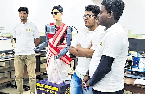 Amarendra, Sadakant and Zaheer pose with the AI teacher 
