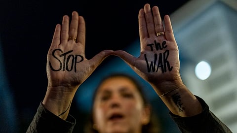 A woman shouts slogans during a protest against Prime Minister Benjamin Netanyahu's government and call for the release of hostages held in the Gaza Strip by the Hamas militant group, in Tel Aviv, Israel, Saturday, Nov. 16, 2024.