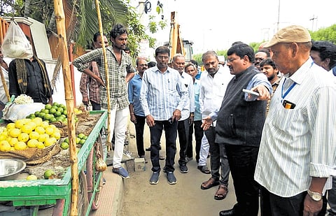 Guntur Municipal Corporation Commissioner P Srinivasulu and other officials inspected the sites proposed for the establishment of vending zones | Express