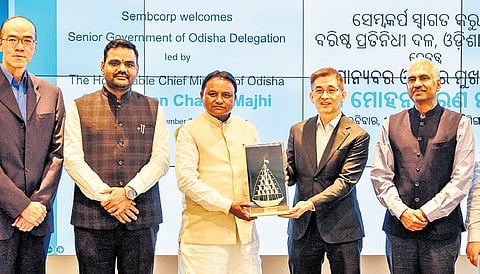 CM Mohan Charan Majhi hands over a memento to group president and CEO of Sembcorp Industries Ltd Wong Kim Yin in Singapore on Sunday 