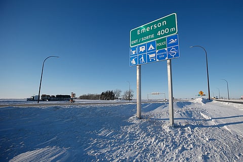 Road signage is posted just outside of Emerson, Manitoba on Thursday, Jan. 20, 2022.
