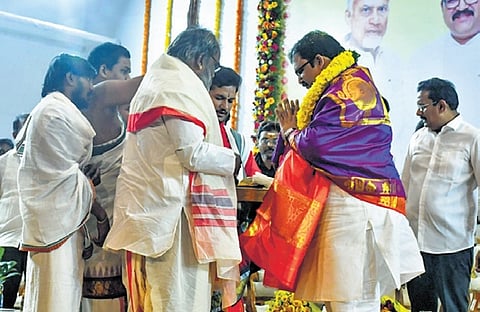 Priests bless TDP leader K Pattabhiram in Vijayawada.