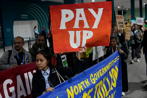 Activists participate in a demonstration for climate finance at the COP29 U.N. Climate Summit.