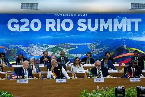 President Joe Biden, from front left, Indian's Prime Minister Narendra Modi, Brazil's President Luis Inacio Lula da Silva, South Africa's President Cyril Ramaphosa and other G20 leaders listen during the G20 Summit at the Museum of Modern Art in Rio de Janeiro, 