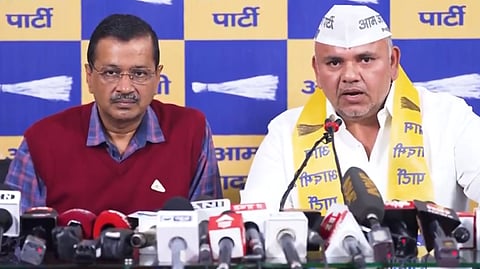 Former Congress MLA Sumesh Shokeen with AAP National Convenor Arvind Kejriwal at a press conference in New Delhi on Monday.