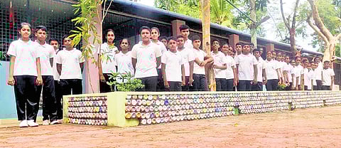 The retaining wall-cum-resting bench made of eco-bricks, constructed by the Student Police Cadets of Government High School, Avanavancherry