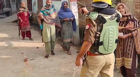 UP by-polls: Cop points pistol at Muslim women coming out to vote; SP demands action 