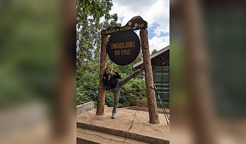 Just for kicks: 13-year-old Anna Mary atop Stella Point