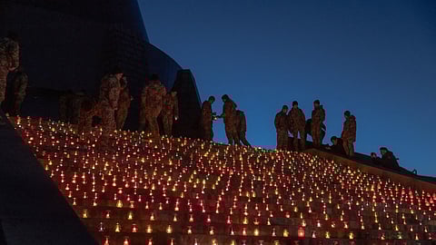 Ukrainian cadet servicemen lay lit candles in front of the Motherland Monument on November 19 marking the 1,000th day of the Russian invasion of Ukraine.