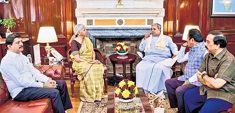 Chief Minister Siddaramaiah calls on Union Finance Minister Nirmala Sitharaman to discuss the issue of NABARD funding to Karnataka being cut, as state ministers Byrathi Suresh and N Chaluvarayaswamy look on, in New Delhi on Thursday 