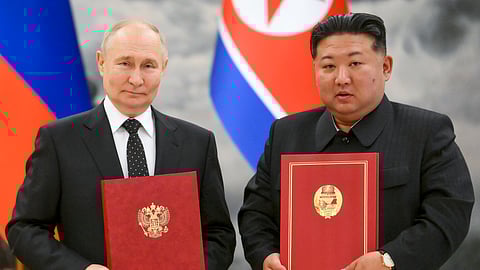 Russian President Vladimir Putin, left, and North Korea's leader Kim Jong Un pose for a photo during a signing ceremony of the new partnership in Pyongyang, North Korea, on June 19, 2024. 