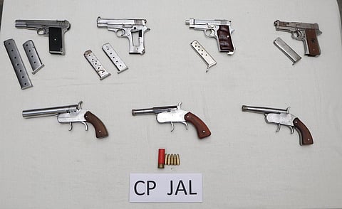 The seven weapons along with six magazines and six cartridges that were recovered.  