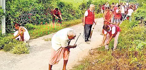 Sudarshan Mohapatra and his team carrying out cleanliness drive at a village in Balasore district.