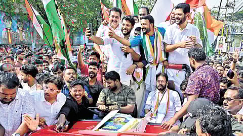 Vadakara MP Shafi Parambil taking a selfie with Rahul Mamkootathil and fellow UDF leaders during the victory rally taken out in Palakkad after the bypoll win on Saturday 