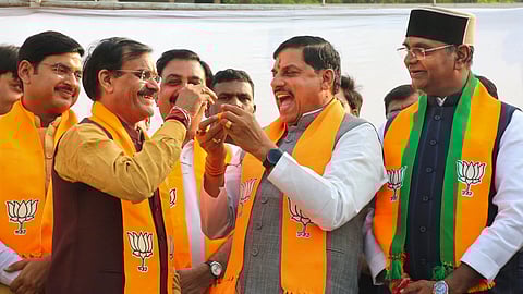 Madhya Pradesh CM Mohan Yadav with state BJP President VD Sharma celebrates the party's victory in the Maharashtra Assembly elections and the state's Budhni Assembly constituency bypoll, in Bhopal.