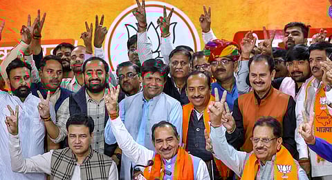 Rajasthan BJP President Madan Rathore reacts along with supporters during a press conference after the bypoll election results, at BJP office in Jaipur.