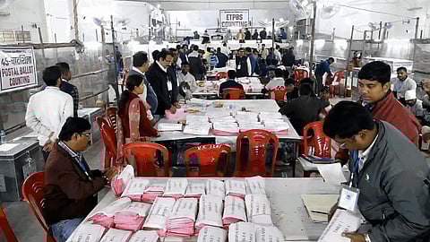 Polling officials at a counting center during the counting of votes for the Jharkhand Assembly elections