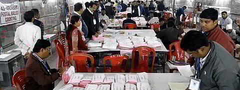 Polling officials at a counting center during the counting of votes for the Jharkhand Assembly elections