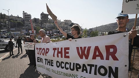 Israelis and Palestinian citizens of Israel protest Israel's military operations in the Gaza Strip, in Umm al-Fahm, Israel, Friday, Nov. 15, 2024