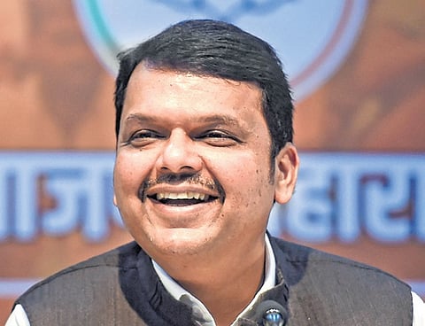 Maharashtra Deputy Chief Ministers Ajit Pawar (L) and Devendra Fadnavis (R)