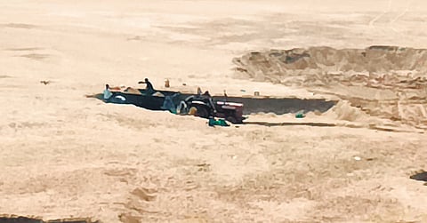 Smugglers dig for sand near the Godavari bridge in Sarapaka