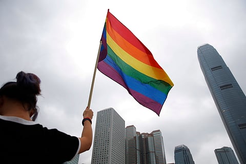 A participant holds a rainbow flag at the annual Pride Parade in Hong Kong, Nov. 17, 2018. 