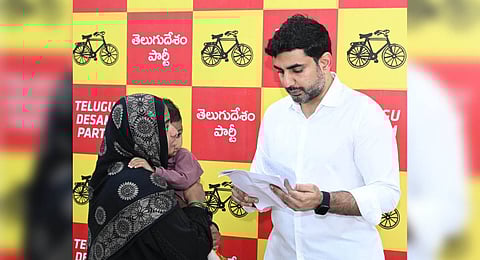 Minister for IT Nara Lokesh takes representations from public during Praja Darbar on Monday.