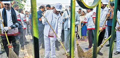 CM Mohan Majhi leads a cleanliness drive at Capital Hospital on Tuesday 