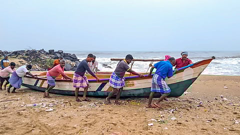 Fishermen move a boat to a harbour amidst a warning issued by the India Meteorological Department (IMD) that a deep depression over the southwest Bay of Bengal is likely to intensify into Cyclone 'Fengal' and move towards Tamil Nadu, in Mayiladuthurai, Tamil Nadu, Wednesday, Nov. 27, 2024. 