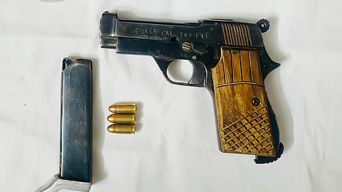 The police recovered two .32 calibre pistols along with seven cartridges from their possession.